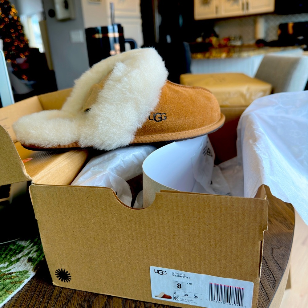 Brand new pair of Ugg slippers.